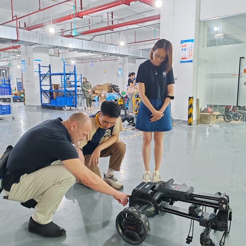 B2B Buyers inspecting terrain-ready golf trolleys